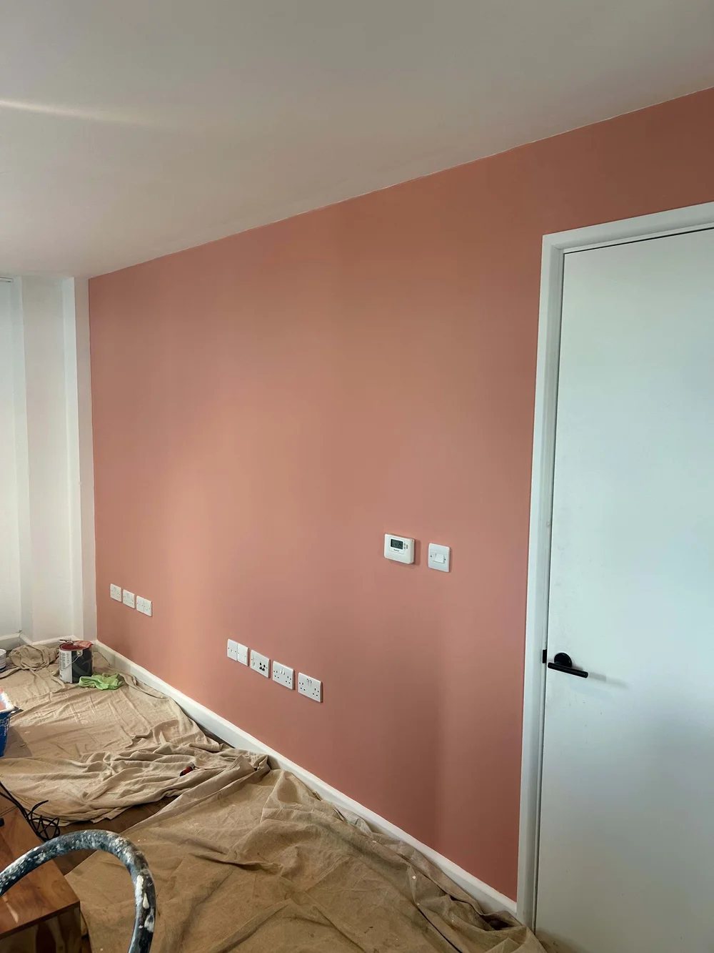 Feature wall repair and decorating in an East London new build